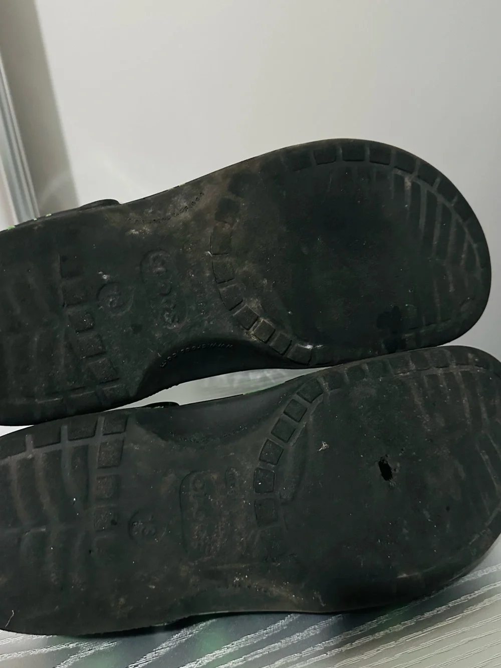 CROCS Black Slip-On Clogs with Green Leaf Print